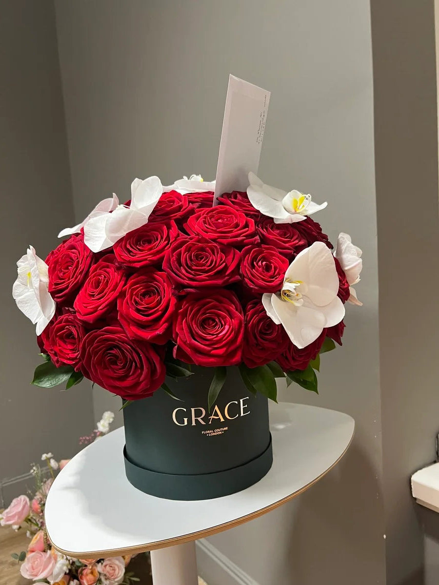 Red roses with orchid