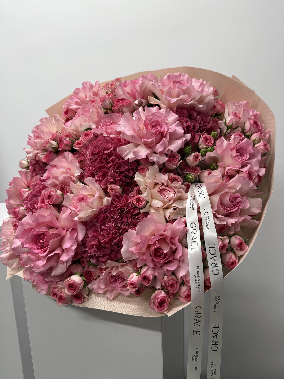 Dark Pinky spray rose and hydrangea bouquet by Grace Floral London