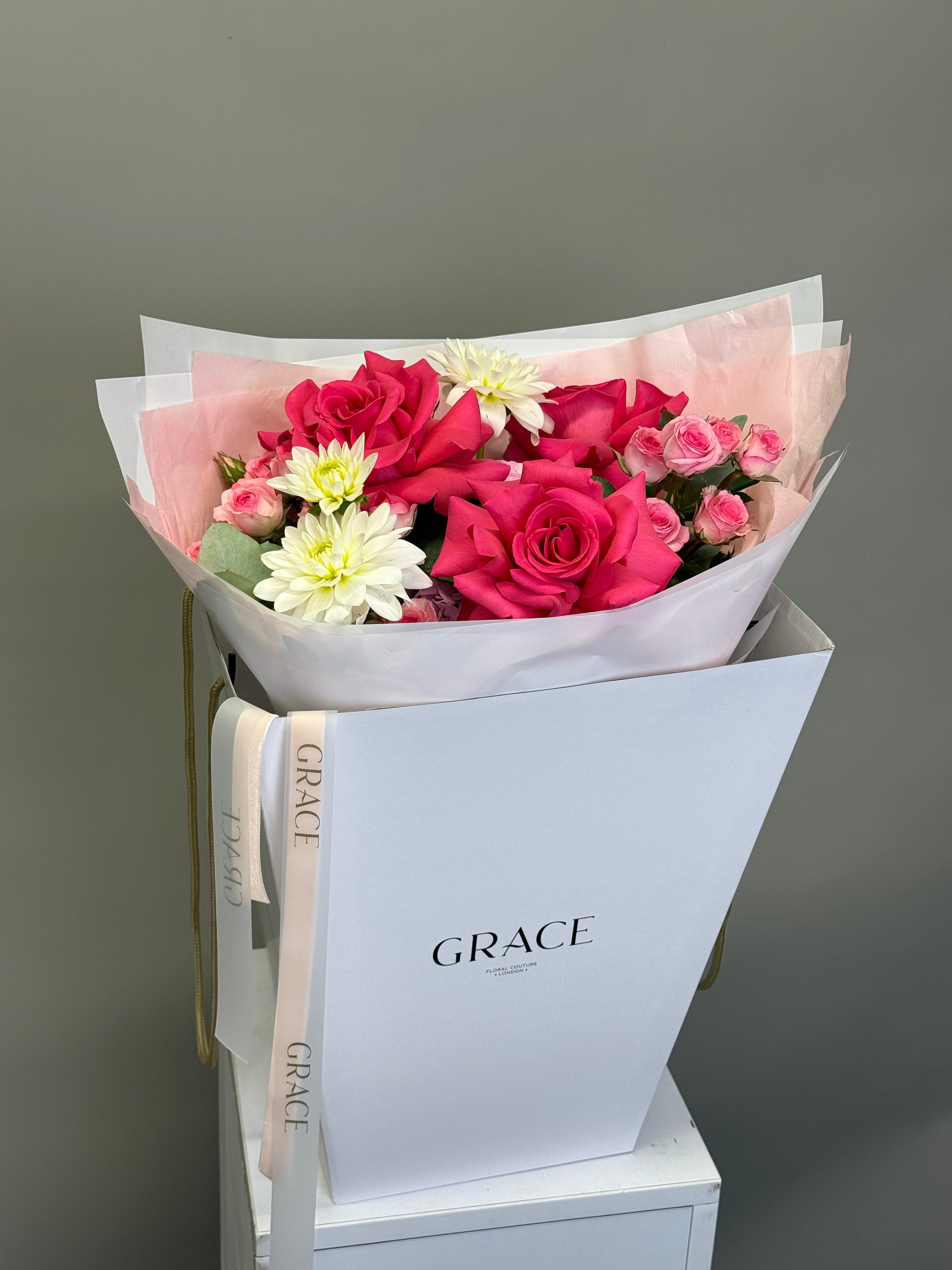 Close-up of pink roses bouquet with pink hydrangea and eucalyptus, Grace Floral Couture London