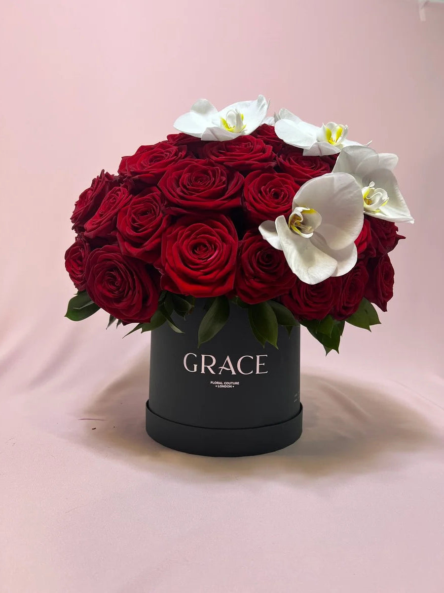 Red roses with orchid