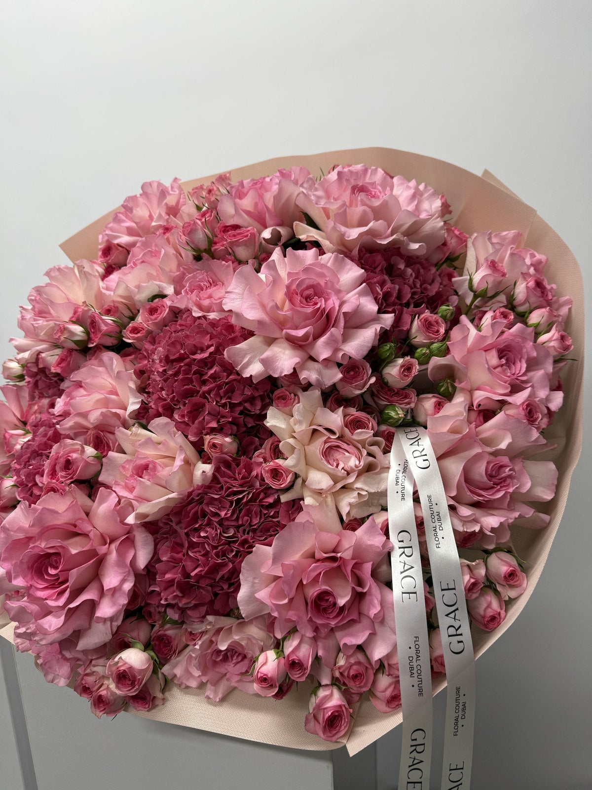 Dark Pinky spray rose and hydrangea bouquet by Grace Floral London