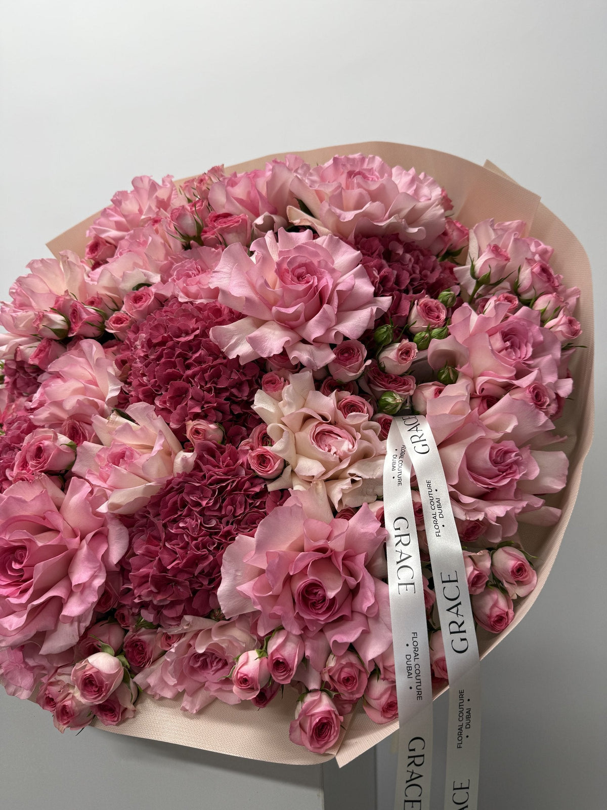 Dark Pinky spray rose and hydrangea bouquet by Grace Floral London