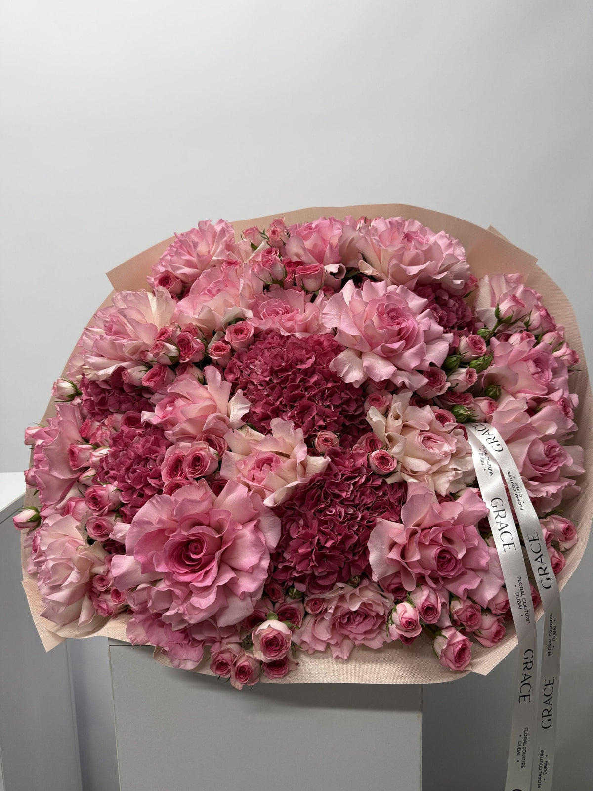 Dark Pinky spray rose and hydrangea bouquet by Grace Floral London