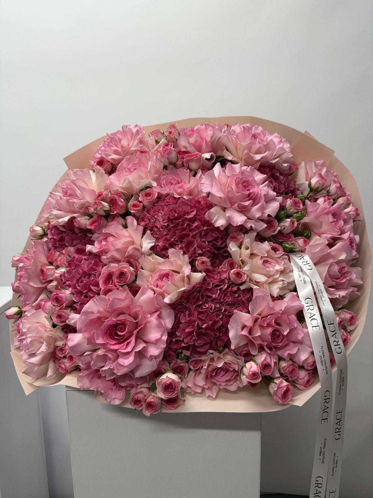 Dark Pinky spray rose and hydrangea bouquet by Grace Floral London