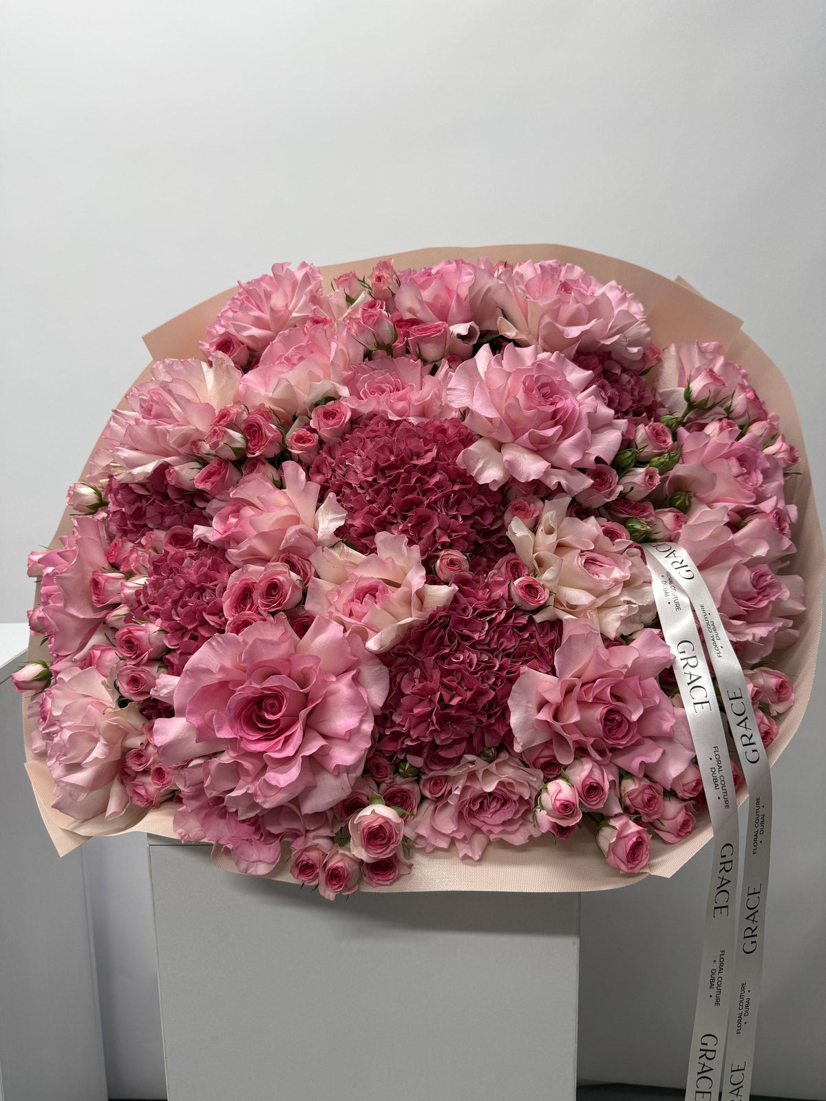 Dark Pinky spray rose and hydrangea bouquet by Grace Floral London